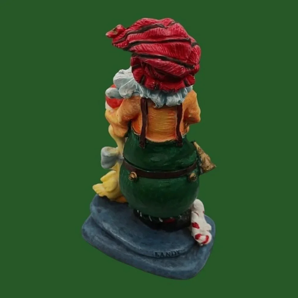 Santa claus figurine with gift and duck